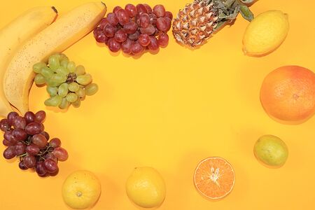 Fruits on a yellow background. The concept of healthy and natural foods to enhance immunity, a healthy lifestyle and weight loss, vitamins, diet food. Summer banner for the screen,の写真素材