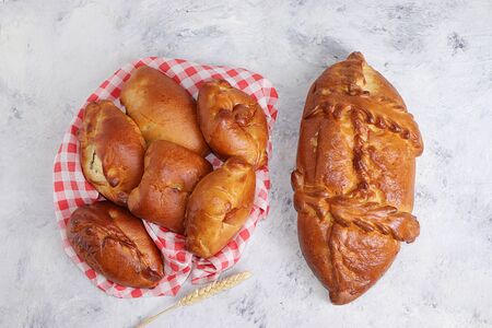 Homemade stuffed pies, bread on a concrete table, concept of healthy and natural food, useful...