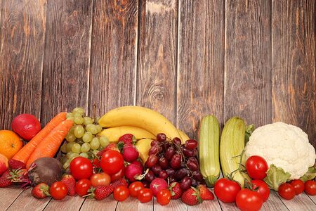 Vegetables, fruits on a wooden background. The concept of healthy and natural foods to enhance immunity, healthy lifestyles, vitamins, detox diet. Summer banner,の写真素材