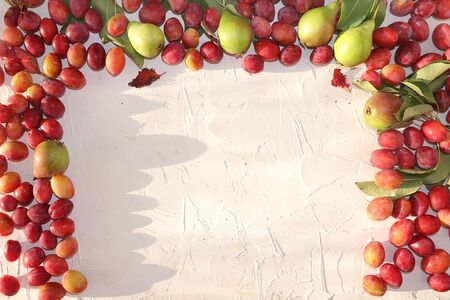 Pear and plum on a sunny table, summer banner, concept of healthy and natural food, diet detox,...