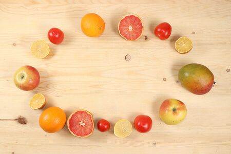 Tropical fruits, grapefruit, orange, lemon on a wooden background, summer banner. The concept of a healthy and natural food, detox diet. Place for textの写真素材