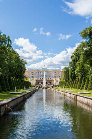 Russia, St. Petersburg, Peterhof, July 9, 2020. In the photo, the fountain of the Grand Cascade in the Lower Park of the State Museum-Reserve Peterhof and people walking in the parkのeditorial素材