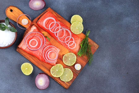 Smoked trout with salmon red fish Steak served with herbs, pepper and salt salmon Preparation Seafood healthy natural food Concept Selective focusの写真素材