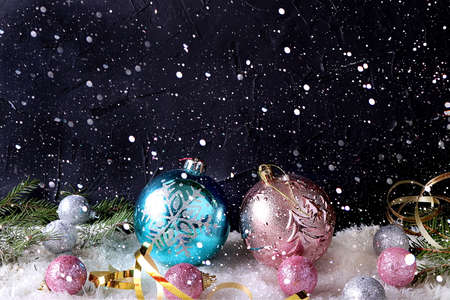 New year background with bokeh lights, for branches with pine cones and decorations in snow flakes....