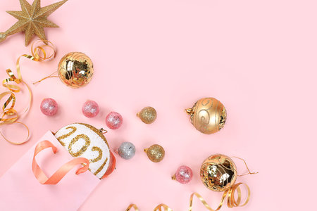 Christmas composition with decorations, gift bag and toys, postcard, minimal holiday shopping concept, modern christmas background, banner for screen, place for text,の写真素材