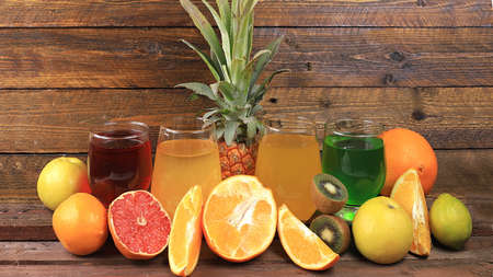 Fruit juice and ingredients, summer tropical drinks on a wooden table, detox diet and weight loss concept, healthy and natural food, source of vitamin C, selective focus,の写真素材