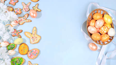 Happy Easter concept, spring card, composition with flowers, cookies and eggs on a gentle...