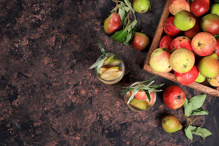 Mulled wine made from apple and pear cider, an autumn drink. Diet and weight loss concept. Fruits help cleanse the body and strengthen the immune system. Healthy eating, body detoxification, selective focusの写真素材