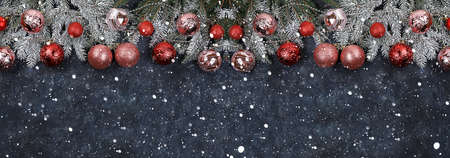 Christmas and New Year background with lights and bokeh decorations, toys with fir branches in snow...