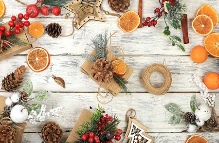 Christmas composition, zero waste trend with recycled craft packaging and wooden decorations,...