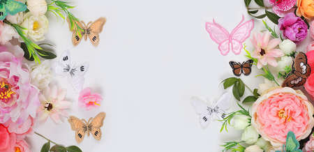 Abstract floral composition, still life, spring banner, beautiful flowers and butterflies with place for text, holiday concept. Mother's day card, women's day, happy birthday, wedding, selective focusの写真素材