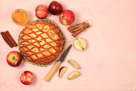 Apple pie with honey,apples, spices, modern bakery concept, place for menu and recipe, selective focus, top viewの写真素材