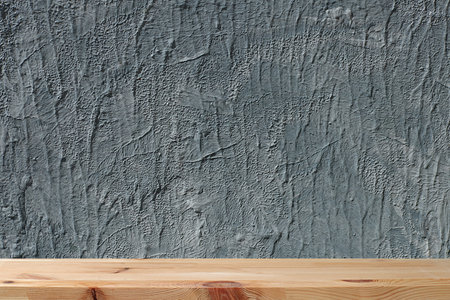 Empty wooden table with old grunge background with space for text, gray concrete wall with bright texture, rustic style, eco concept, kitchen mockup for design and showcase for product display, selective focusの写真素材