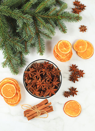 Christmas composition with traditional winter spices to boost immunity during the cold period. Star anise, cinnamon, dried oranges and tangerines with spruce branches. New Year's Eve and Christmas conceptの写真素材