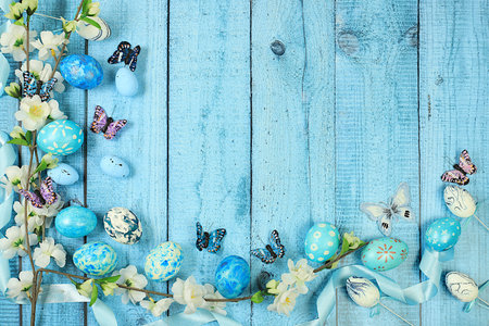 Happy Easter concept, Composition with decorated Easter eggs, butterflies and apple tree branches. banner or advertisement for screen or store, template for design, spring card, selective focusの写真素材