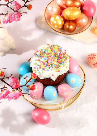 Abstract Easter composition with traditional Russian kulich with meringue and decorated painted eggs...