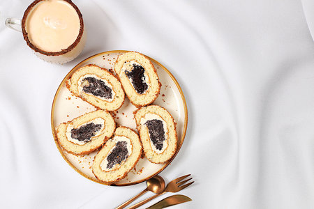 Concept of modern bakery, festive treat. Homemade delicious tiramisu, sponge cake or cake with sweet jam, cream, nuts, cinnamon and milk drink eggnog with cocoa.の写真素材