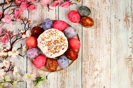 Easter celebration concept, traditional kulich and marble Easter eggs painted with onion peel, ideas...