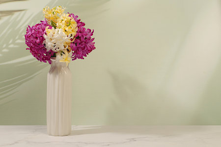 Beautiful banner of different varieties of hyacinths and muscari in a vase, template for design and screen. Abstract flower arrangement. Spring card, business card for product demonstration, gift for loved onesの写真素材