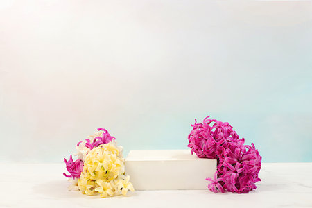 Abstract beautiful flower arrangement with hyacinths.Empty product podium and fresh live spring flowers.Stage for business concept.Minimal modern aesthetics and elegant beauty concept,の写真素材