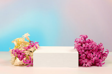Abstract flower arrangement with hyacinths, banner.Creative template for your design.Empty product podium and spring flowers.Minimal modern aesthetics,elegant beauty concept,の写真素材