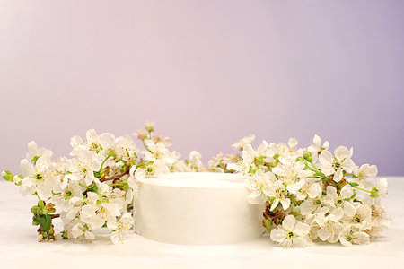 Abstract floral arrangement with cherry blossom branches, banner. Creative template for your design. Empty product podium and spring flowers. Minimal modern aesthetics, elegant beauty concept,の写真素材