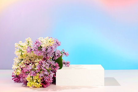 Abstract floral arrangement with white and purple lilac flowers, banner. Creative template for your design. Empty product podium and spring flowers. Minimal modern aesthetics, elegant beauty concept,の写真素材