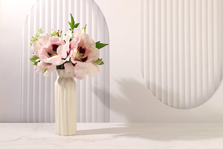 Still life with spring flowers mountain peony in vase on elegant modern table,template for your design with space for text,minimal beauty concept,beautiful flower card,abstract flower arrangementの写真素材