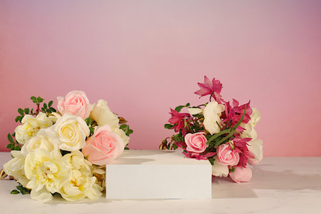 Empty product podium and cream roses. Creative template for your design. Abstract flower arrangement with rose hips, banner. Minimal modern aesthetics, elegant beauty concept,の写真素材