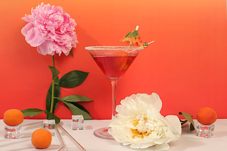 Minimal summer party concept, advertising banner for bar, cafe. Modern still life with pink martini, summer alcoholic cocktail with apricot for party and peonies on elegant modern background,の写真素材