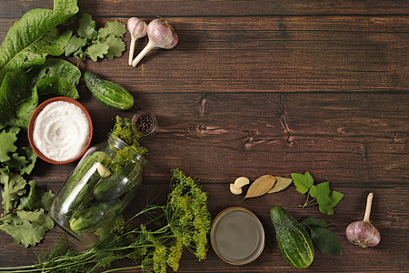 Homemade pickling recipe, cucumbers and pickling ingredients, home canning concept.Fresh pickled...