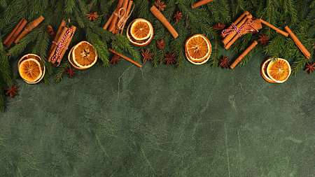 Christmas composition and New Year 2026 concept, live fir branches with dried oranges, star anise,...