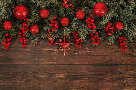 Festive winter greeting card and banner on the screen, Beautiful Christmas and New Year background with lights, decorations, toys and live fir branches, product design for holiday advertising, Christmas Eve concept,の写真素材