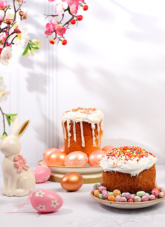 Abstract Easter composition with traditional Russian kulich with meringue and decorated eggs on...