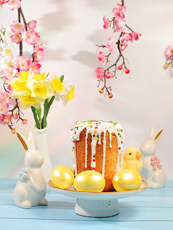 Traditional Easter cake and marbled Easter eggs, decorated with golden turmeric and hibiscus tea,...