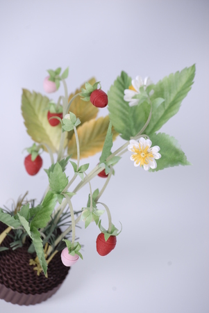 Branch strawberry. Summer memories. Colorful flowers. Decorative work. Made in the technique of quilling. Hand made by Svetlana Bukinaのeditorial素材