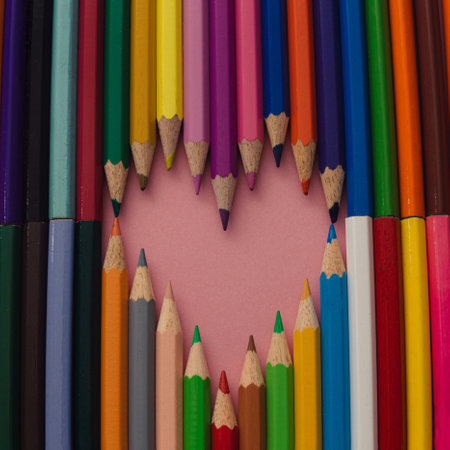 Wooden crayons make a heart shape. Creative idea.の写真素材