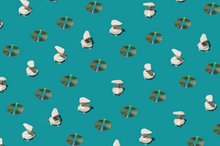 Pattern of the retro joystick and cd and the turquoise background.の写真素材