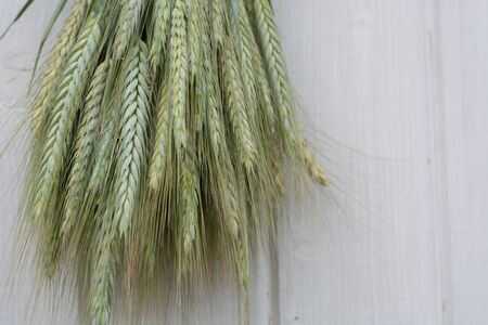 Wheat on wooden tableの写真素材