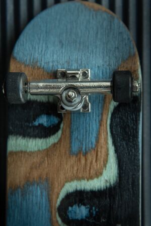 Front view of the back of a skate board with black wheelsの写真素材
