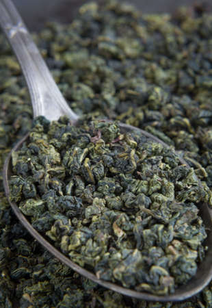 Green tea on metal spoon