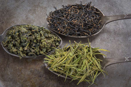 Green tea on metal spoonの写真素材