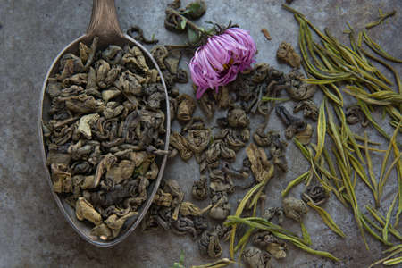 Green tea in metal spoonの写真素材