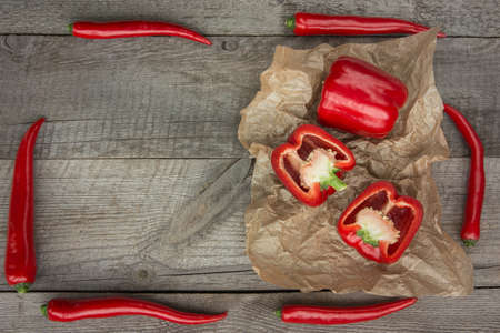 Red Hot Chili Peppers on vintage wooden board for your recipe. Top view with copy space.の写真素材