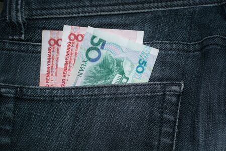 China yuan  in the Pocket of the Jeans.  Top view.の写真素材