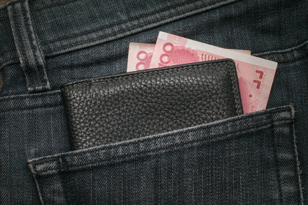 China yuan in the Pocket of the Jeans. Closeup. Top view.の写真素材
