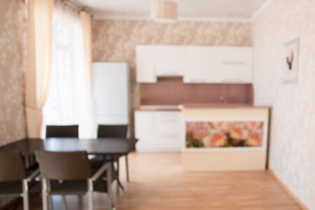 Blurred background. Modern kitchen with tabletop and space for you.の写真素材