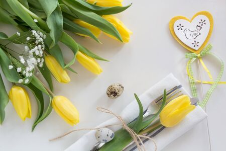 Easter concept with copy space for your Happy Easter wishes. Decorative easter place setting with...