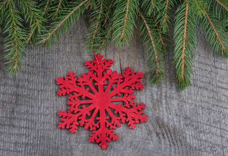 Wooden red snowflakes on a wooden background. Top view.の写真素材