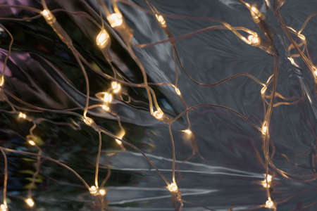 Blurred garland. Christmas holiday. Abstract Xmas pattern. Defocused backgroundの写真素材